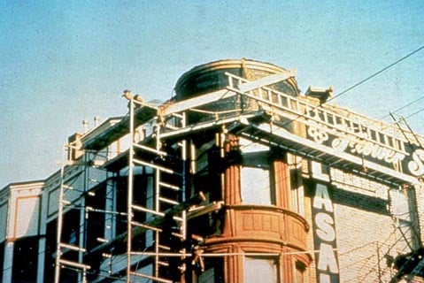 Example of dangerous scaffolding in construction, showing ladders and boards being used for support (IMAGE - OSHA)