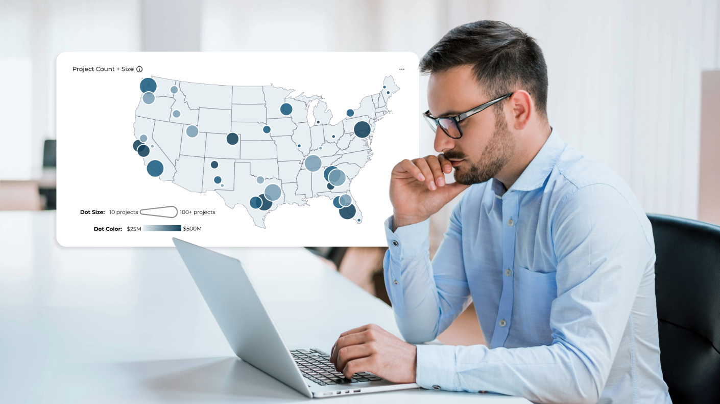Man working on a laptop using ConstructConnect Analytics