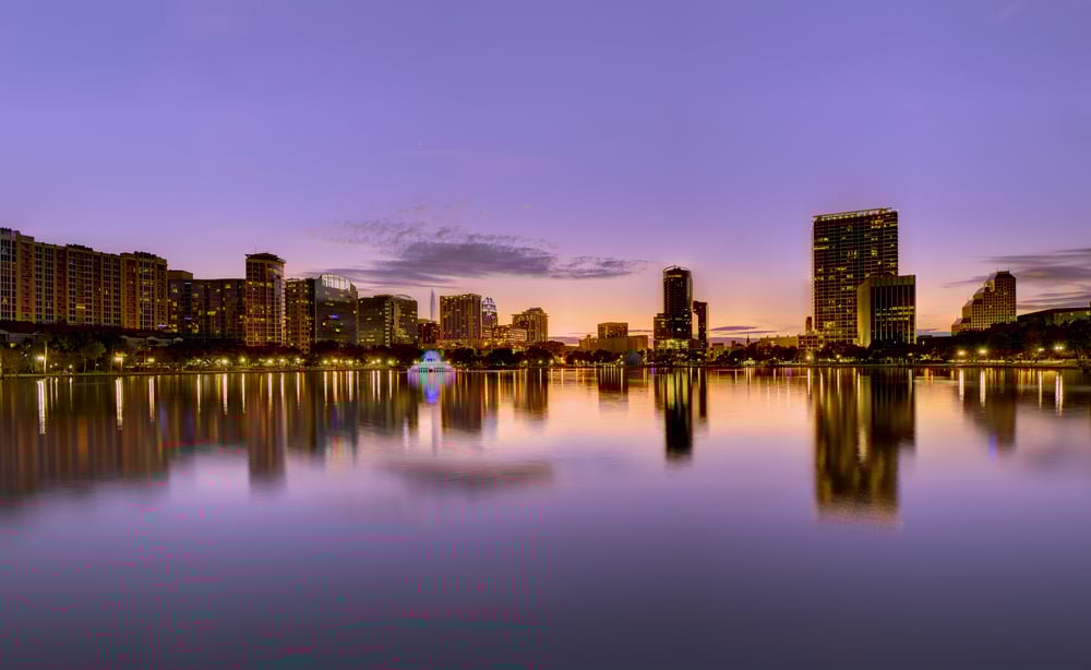 florida skyline shown at sunset with commercial buildings along a winding coast